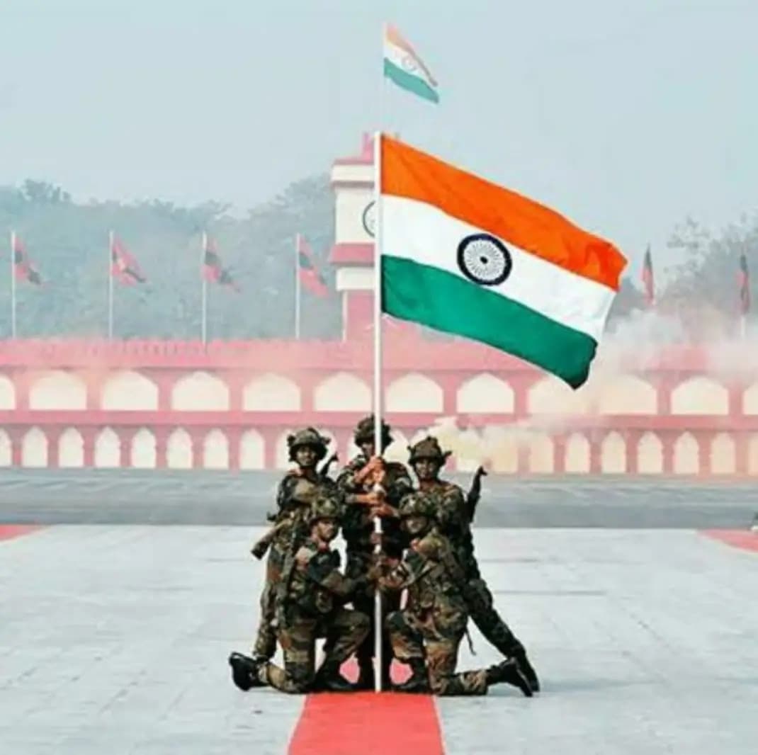 Indian soldiers holding the national flag